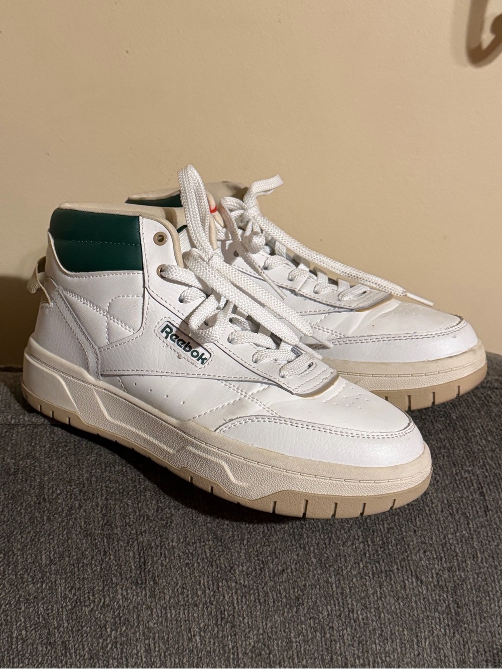 Reebok Women’s Tech Geo Classic Hi High Top sneakers in Alabaster/Dark Green.